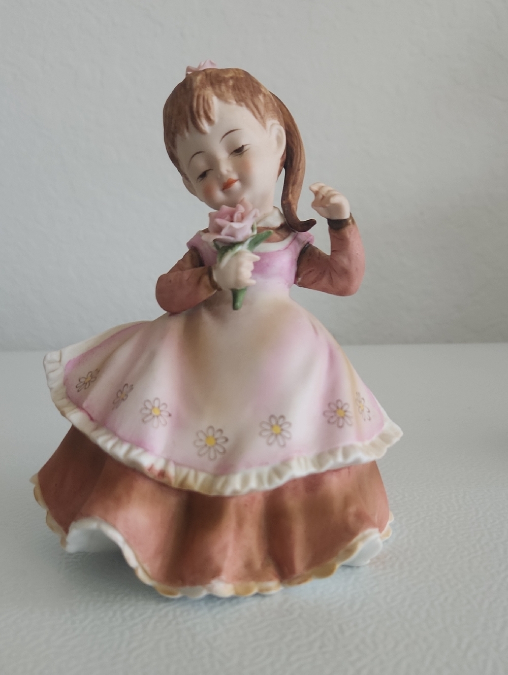 Porcelain Girl Figurine Holding Pink Rose